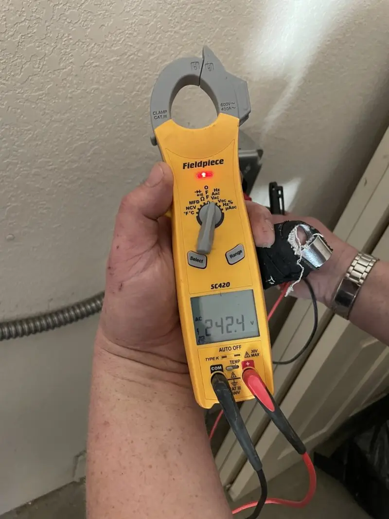 Voltage testing with clamp meter during Outlet Installation in Cudahy
